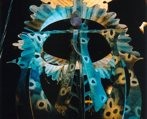 From Transforming Art by Chris Hardman, Reflected Symmetry is two mirrors set at 90 degrees with sculpted wooded, painted pieces placed between them.One-quarter of the image is real and three-quarters is not, only reflection.